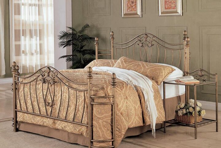 This Sydney metal bed has an elegance fit for a classic-style home. It features elegant headboard and footboard with curved crowns and swirling floral motifs. The wraparound look on both ends adds a traditional touch. It's finished in warm antique brushed gold that conveys class and charm. This metal bed has a timeless design that blends well with different decor and furnishing tastes.