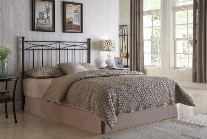 This metal headboard will give your bed a transitional feel. Clean lines combine with curved ones at the top with knob attachments that evoke rustic charm. Posts are topped by simple crown fixtures. The straight metal construction is durable and wrapped in bronze. Headboard fits either full or queen frame and bed sizes.