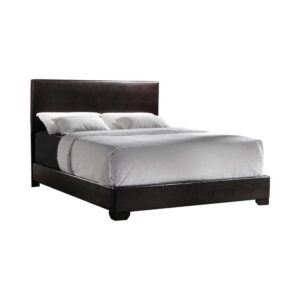 contemporary styled bed. It features straight lines and crisp edges for a look that's smooth and effortless. The bed is expertly upholstered in sumptuous leatherette for a handsome appeal. It features stout solid wood legs for long-lasting durability and styling. This bed imparts a mellow yet classy look to the bedroom.