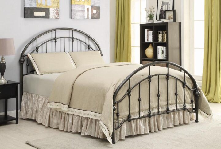 Complete a master bedroom with a decorative touch of glamour. This beautiful eastern king bed pulls a room together in style. Its arched headboard and footboard are adorned with intricate metal accents. A classic bronze finish adds a hint of subdued elegance. Top-quality metal craftsmanship rounds out its traditional appeal.