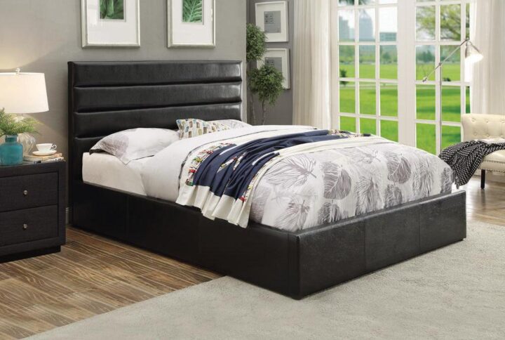 From the Riverbend upholstered bed collection comes this casual hydraulic lift storage bed. It combines stylishness with function. Clean lines and a plush slat-style headboard highlight its design. It's crafted with convenient underneath storage for extra linens. The bed is upholstered in sumptuous black leatherette that fits other bedroom decor.