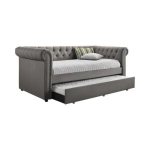 this twin daybed with trundle looks great in a chic living room. Featuring a high rolled and arms with button tufting