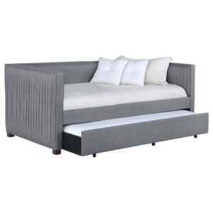pleated and overlapping along the surface of this twin daybed and trundle set