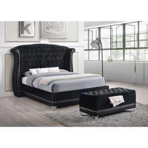 This magnificent bed is designed for sleeping in comfort and style. Headboard is constructed with button tufting and a wingback design that warmly embraces you. Bed is wrapped in sumptuous black with contrasting nailhead trim throughout. It's a bed fit for a regal setting. Note: a box spring is required for this majestic bed.