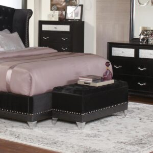 black frame is livened up by chic button tufting on the top and silvery nailhead trim along the bottom edge. High-shine
