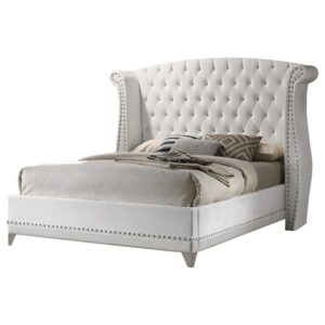 Instantly achieve an elegant upgrade for your sleeping space with this upholstered velvet bed. A dramatic wingback headboard creates a focal point you can't forget. It is adorned with button tufting and crystal-like accents. Nail head trim further enhances this piece on the headboard as well as the frame. It is supported on sleek tapered legs for an extra stylish appeal.