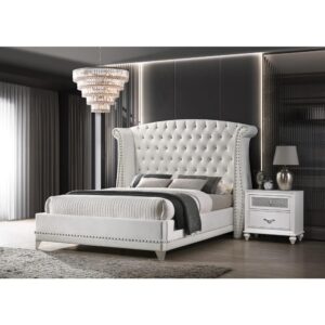 Instantly achieve an elegant upgrade for your sleeping space with this upholstered velvet bed. A dramatic wingback headboard creates a focal point you can't forget. It is adorned with button tufting and crystal-like accents. Nail head trim further enhances this piece on the headboard as well as the frame. It is supported on sleek tapered legs for an extra stylish appeal.