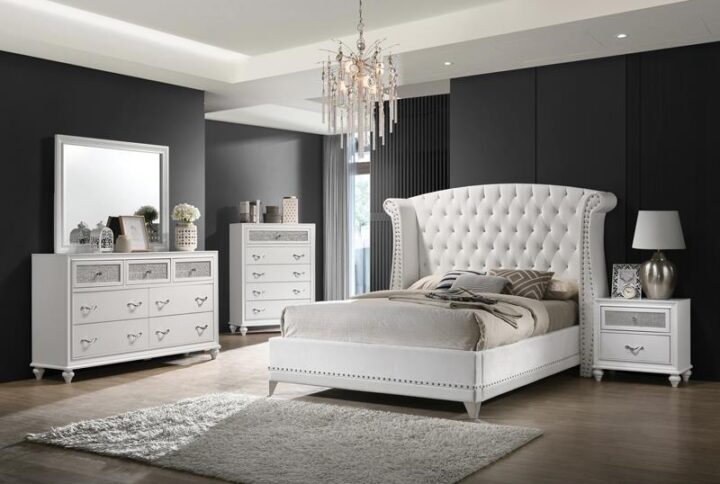 Get ready to add exquisite glamour to your space with this white upholstered bedroom set. The dramatic headboard offers incredible contemporary appeal with velvet upholstery