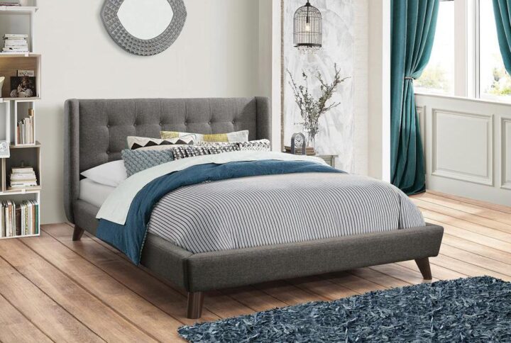 Go all-in on a retro motif with this mid-century modern-inspired bed frame. In a textured grey upholstery