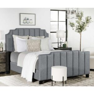 Artistry and tasteful silhouetting deliver a stunning elegance to a master or guest suite when this decadent upholstered bed becomes a focal point. A hint of Art Deco flavor shapes a vertically channeled headboard with notched edges