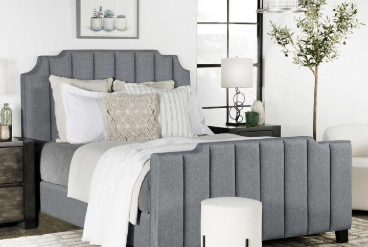 Artistry and tasteful silhouetting deliver a stunning elegance to a master or guest suite when this decadent upholstered bed becomes a focal point. A hint of Art Deco flavor shapes a vertically channeled headboard with notched edges