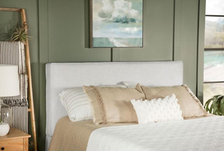 The exemplary and simple style of this classic headboard offers a perfect update to any bed. This upholstered headboard blends clean lines and dimensional upgrades to transform a bedroom into a haven for relaxation. Self-welt construction details add a sleek look to the outer border. Textured sand finish fabric wraps over the headboard