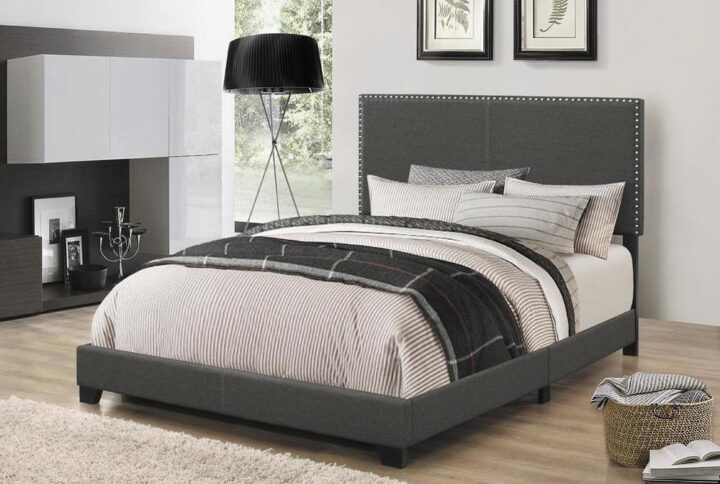 Embrace a relaxed modern style with the smooth edges from this upholstered bed frame. Complete with solid wood legs in black finish