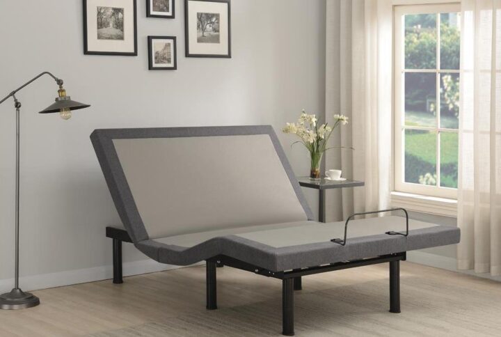A contemporary California king adjustable bed allows you the freedom of precise positioning to create the relaxing sleep haven of your dreams. Dark gray upholstered rails add a polished touch while six legs adjust in height to suit any bedroom. The bed includes a wireless remote control with pre-set zero gravity