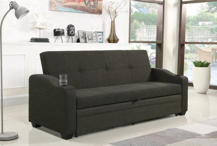 Decorate your living room with the clean lines from this sofa bed with sleeper. Smooth and textured fabric in a charcoal grey finish features slight tufting