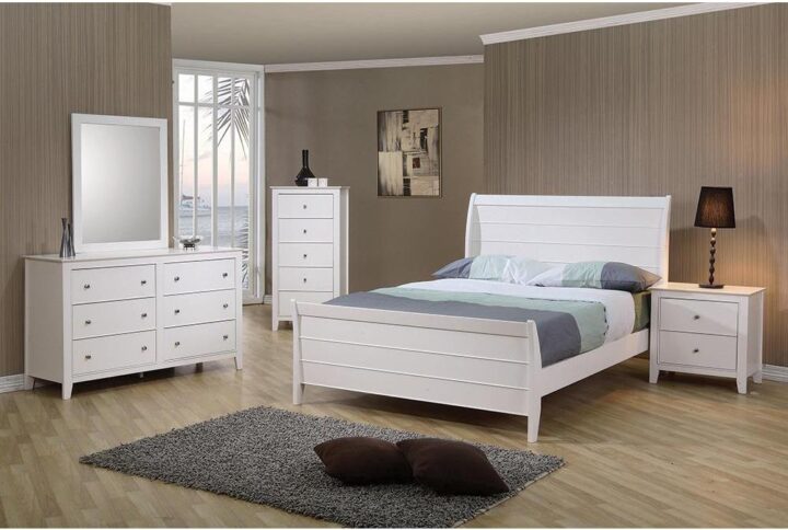 Country chic style is heightened with this stunning four-piece bedroom set. Clean lines along the silhouette of the nightstand