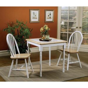 This dining table brings a new dimension to two-tone tables. Table top features white tiles that are bordered by natural brown wood finish. Legs are finished in white and offer slight curvy detailed carvings near the top and bottom. Table is crafted in Asian hardwood for staying power. Pull up a matching two-tone dining chair (not included) and enjoy a sandwich or engaging conversation.