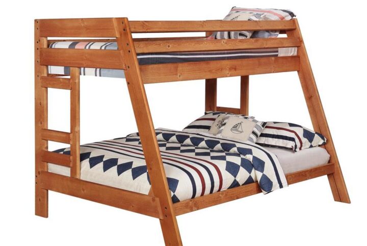 The Wrangle Hill collection includes this twin/full bunk bed that's sure to please. The bed is crafted from solid pine for durability and beauty. Full-length guard rails on the top bunk ensure safe sleeping. Finished in amber wash