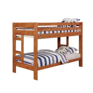 The Wrangle Hill collection features this rustic wood bunk bed that conveys pastoral simplicity. It is beautifully constructed in solid pine that is durable and sturdy. The entire piece comes in an amber wash finish. Full length guard rails keep the top sleeper safe and each bed fits a twin mattress. Slat kits and trundle with bunkie mattress are both sold separately.