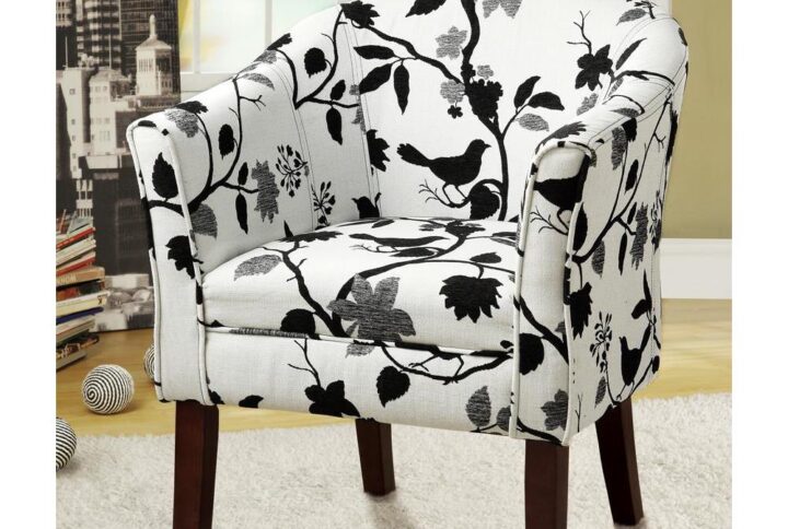 This accent chair gives you the chance to express your style. It comes in a thrilling bird and branch pattern fabric that livens up a casual living room. The bird and branch are black and grey set against a white background for a contrast that starts conversations. Chair has a barrel back and flared arms for comfortable seating. Leg finish is dark cappuccino for a further touch of distinction.