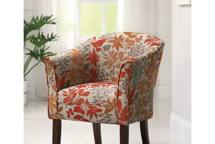 Express your one-of-a-kind style with this can't-miss accent chair. Traditional style arm chair comes with a splash of color that warmly complements a living room with casual decor. Chair fabric features autumn leave pattern in orange and red with a touch of gold. It is sturdily constructed with flared arms and a barrel back for comfort. Leg finish is in dark brown to complete what is sure to be a conversation starter.