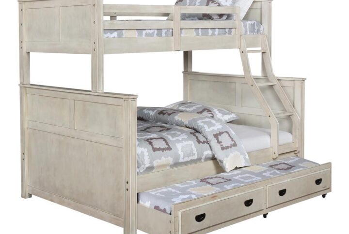 Elevate your child's bedroom extra versatility and sleep space with this modern rustic trundle. It's crafted in an elegant hand-brushed antique white finish for a farmhouse appeal. Front panels and contrasting dark hardware provide a touch of style. Rolling wheels make it easy to pull out and push back under. This handy trundle gives your children's bunk bed added appeal when a sleep over is called for.