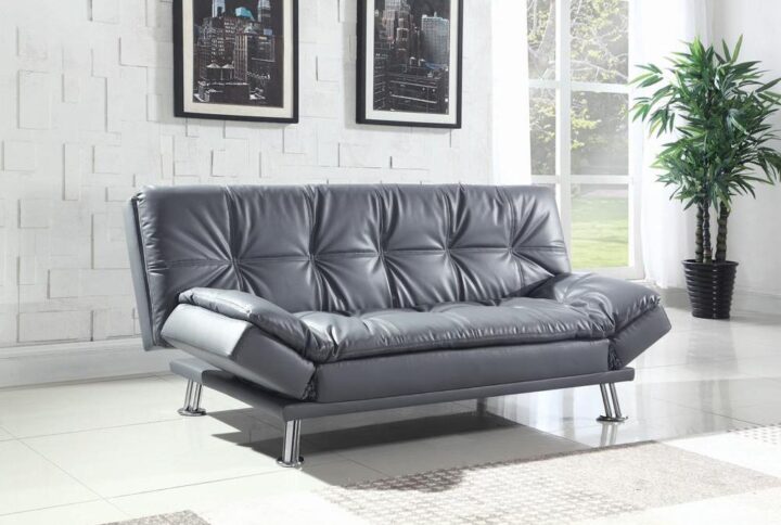The contemporary Dilleston collection presents this sofa bed and futon that adds distinctive style and function to a family room or living room. It's upholstered in dashing grey leatherette that matches any decor. Plush pillow-top seating simply enwraps you in comfort. Adjustable armrests hold your arms or head