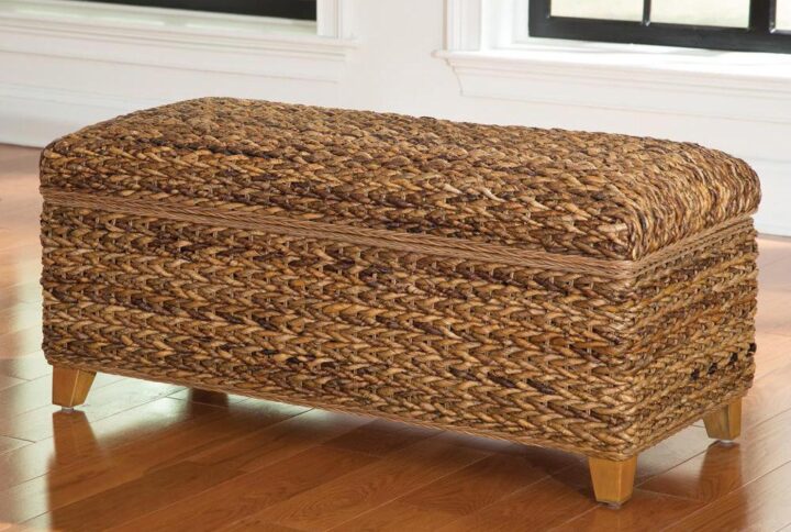 This trunk from the Laughton collection is proof that a trunk can be stylish as well as practical. It's constructed of solid wood and select woven materials that mesh well together. Finished with an amber-colored touch