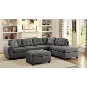 grey sectional. Its linen-like upholstery is enhanced by subtle tufting