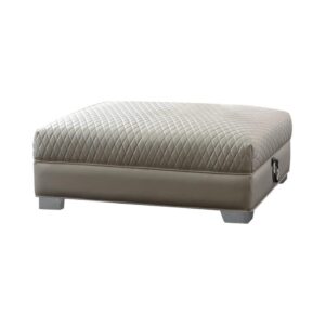 this ottoman reflects a cool Art Deco motif. Revisit designs from eras past with a low-profile ottoman wrapped in fresh pearl white leatherette. Quilted detailing joins chrome doorknocker handles and chrome legs for a vibrant accent effect. Make this ottoman part of a stylish retro themed space.