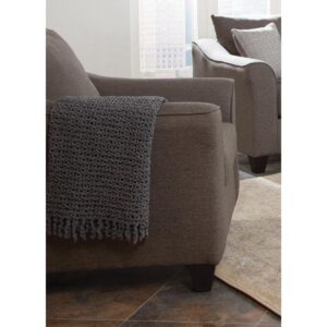this chair fits in with a variety of seating ensembles. Flatter a contemporary space with a contoured silhouette. Flared arms add a chic touch. Wrapped in warm grey upholstery