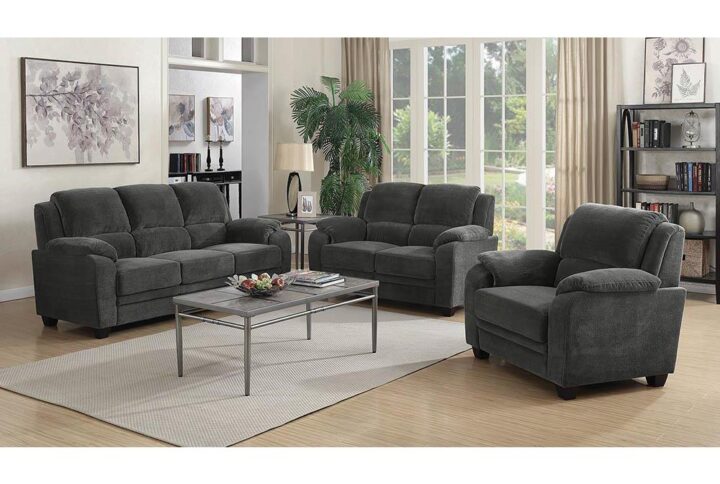 Celebrate the relaxing aura of casual comfort with this three-piece living room set. Padded arms welcome guests and family to the included sofa