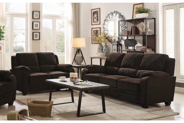 Relax in the casual comfort of plush cushions from this two-piece living room set. Complete with padded arms