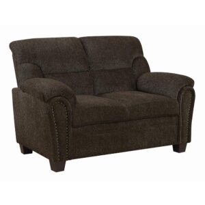 elegant loveseat pulls a room together in style. Its arms boast a graceful