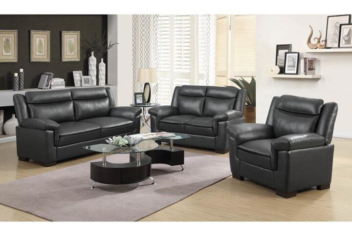 This three-piece living room set combines luxury and comfort. The plush cushions and padded head rests are upholstered in sleek fabric. Modern and elongated