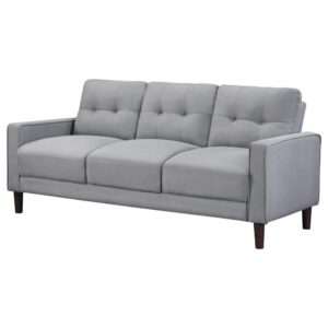 this sofa boasts a perfect small-scale design. Its classic track arm and self-welt detailing highlight the superior tailoring. The grid-tufted boxed back cushions and pocket coil spring cushion construction ensure comfort and support. With brown tall round tapered legs