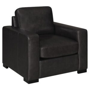 A modern style dark brown armchair is ready to enhance your living space. Made from luxuriously soft top grain fabric