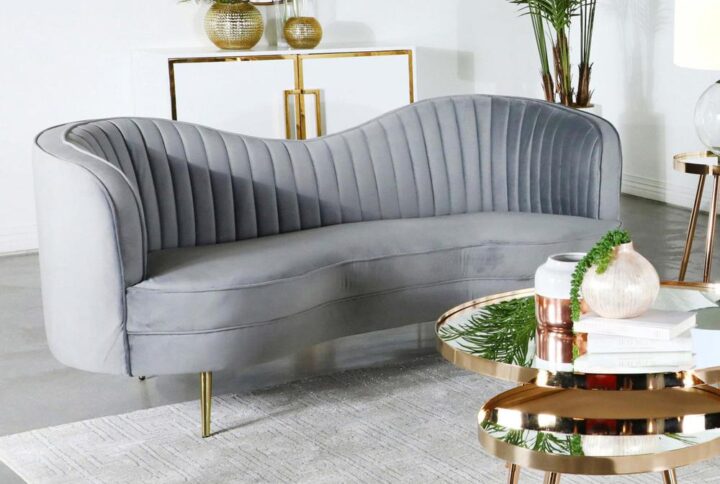 Transform a conventional space into a parlor-inspired retro room with this chic sculptural loveseat. Alluring curves infuse romance into a kidney-shaped loveseat created to become a focal point. This loveseat is fully encased in solid wood and covered in soft