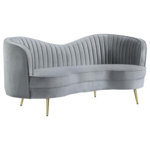 supple gray velvet. Dimensionality and texturizing result from smart vertical channeling on its back interior. Gold finish stainless steel tapered legs round out a list of charming attributes