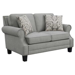 as a fully encased solid wood frame shores up solid construction. Tall back cushions offer perfect proportionality. This loveseat is accented with two square pillows wrapped in soothing