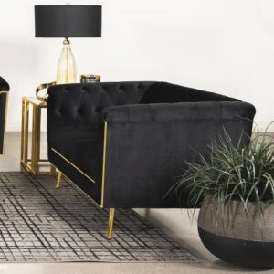 Tuck into the luxurious comfort and sophistication of an eye-catching black velvet loveseat. A seamless blend of mid-century and modern glam design elements