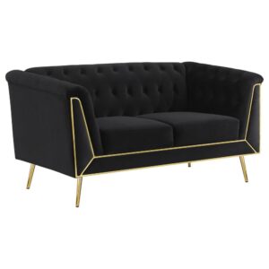 it pairs tuxedo arms with a matching shelter back to create a Chesterfield inspired silhouette. Button tufting across the interior of the loveseat completes the iconic look. The front of the loveseat adds eye-catching appeal with geometric metal trim in a gleaming gold finish that provides a perfect complement to splayed