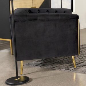 Complete an upscale living space with the luxe look and feel of a modern glam armchair. Plush black velvet upholstery and button tufting create a rich