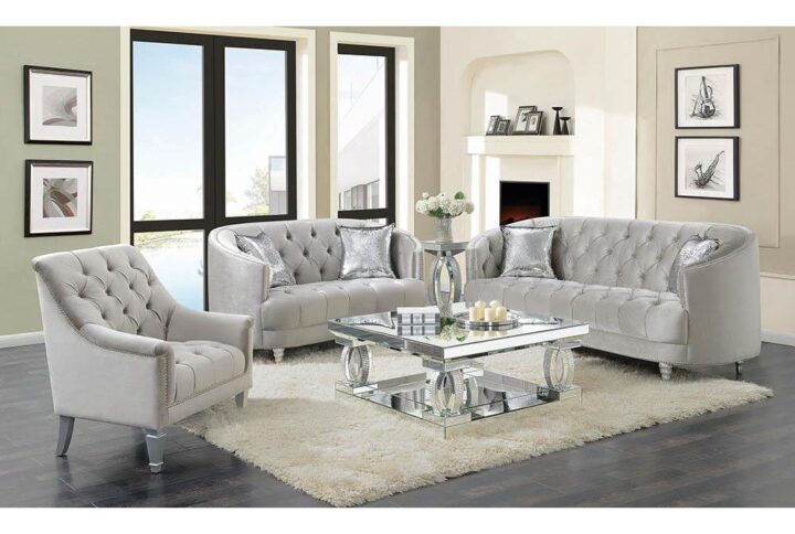 This stationary sofa is as stylish as it is functional. It features an appealing button-tufted design that imparts elegance. Seat back leads to a wraparound armrest that surrounds you in comfort. Extra thick cushions ensure hours of relaxed contentment. It comes wrapped in opulent grey material that will steal the show in your living room.