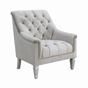 An armchair with polish as well as comfort makes for a splendid addition to any living room or family room. It features button-tufted craftsmanship for a timeless appeal. The high seat is slightly flared for leaning back in peace with perfectly-positioned armrests. A thick cushion and flared legs impart a distinctive charm. Wrapped in alluring grey material that is a perfect match for the sofa and loveseat in the same collection (available separately).