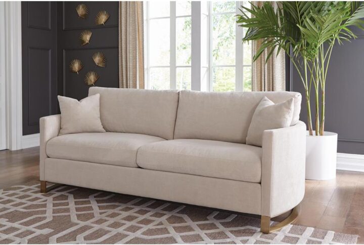 Cool opulence meets magnificent comfort in this plush sofa. It's fashioned with kiln-dried solid pine wood