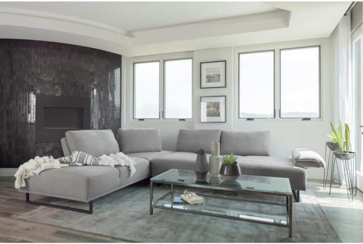 Add modern stylishness to your space with this magnificent contemporary sectional sofa. It is exceptionally upholstered in an elegant taupe woven fabric that's soft to the touch. The powder coated black base features U-frame legs for sturdiness. One end has an open chaise-like design