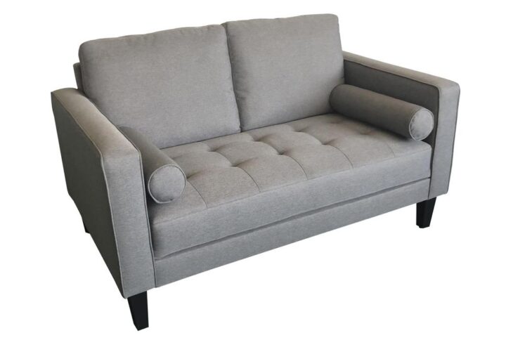 Brighten the look and feel of your home with this trendy Mid-Century Modern loveseat. The cool charcoal finish adds an elegant air that's well matched to most other decor. You'll love the coziness of the plush bench cushion with grid-like tufting. The thin track arms are each fashioned with self-welt details for visual appeal. Add in bolster pillows on each end