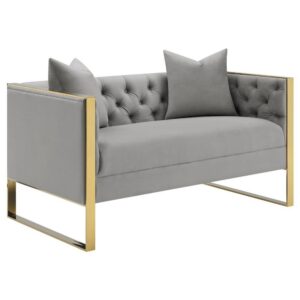 this sofa and loveseat offers a formal touch of Hollywood Regency to a home. Both seats and wrapped in a light grey velvet upholstery