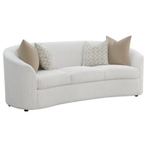 upholstered in a softly textured latte boucle upholstery throughout its elegantly designed
